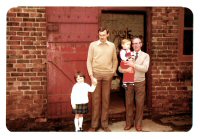 Three generations of the Dawes family outside the Blacksmiths shop on Mansfield Street.
