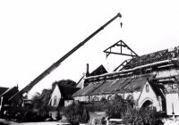 The Church of St. Thomas Crane hoisting a roof truss during the fire repairs in 1980