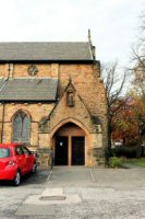 The entrance porch to the Church, 2014 the figure over the door came from the original 1800s Church