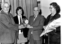 Presentation of a clock by Headmaster Henry Redfern from members of staff and pupils to Mr. George Vertigan on his retirement