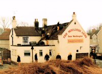 Firemen removing thatch from the Mouldsers Arms at Riddings after a Fire date not known.