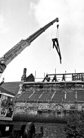 New roof supports being lifted into place after the Church fire in 1984 by the Bowmer & Kirkland crane.