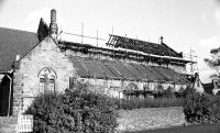 Church roof rebuilding after the fire at St. Thomas in 1984.