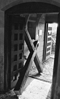 The Church Cross removed into the doorway after the fire at St. Thomas in 1984.