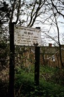 Stanton Ironworks sign stating: NO ROAD Only employees of the company or other persons on business are allowed beyond this point. By order of the Secretary.